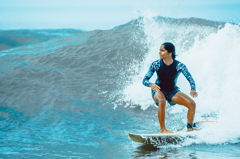 Woman Surfing on Waves